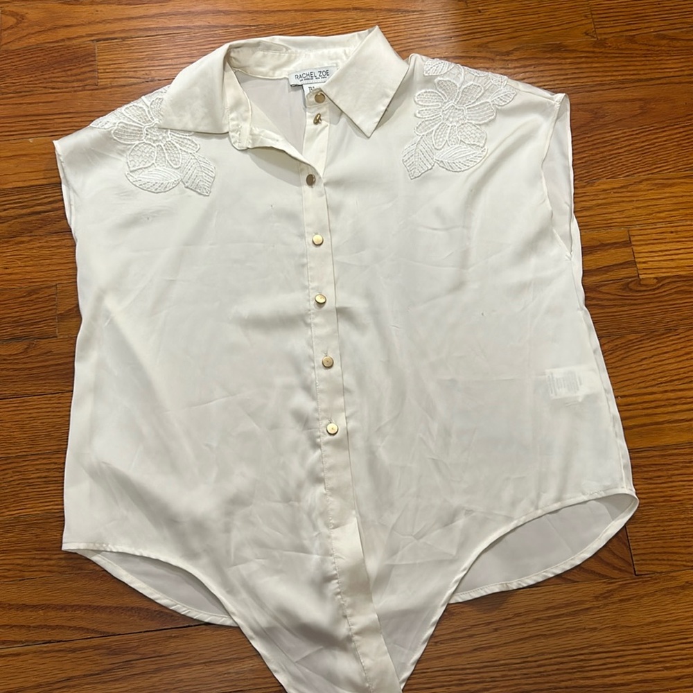 Shirt small in cream color.